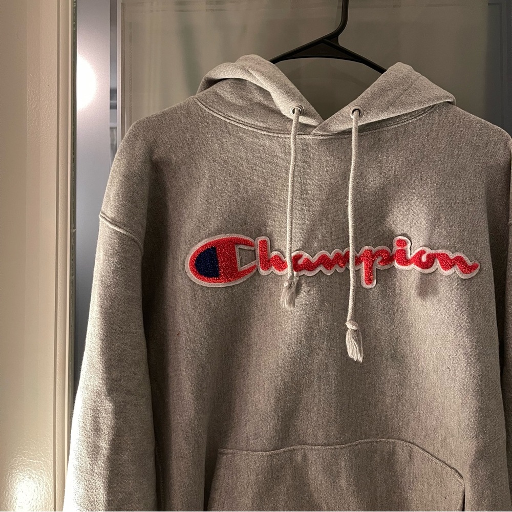 Gray champion hoodie with red lettering